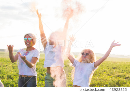 Friendship, Indian holidays and people concept - young women and children dancing on the summer 48928833