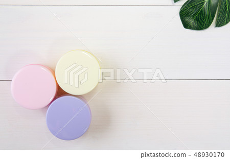 cosmetic and skin care product and green leaves 48930170