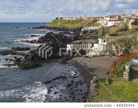 Sand beach of town Vila Franca do Campo with its famous volcanic islet, rock ocean, blue sky and Sand beach of town Vila Franca do Campo with its famous volcanic islet, rock ocean, blue sky and 48930344