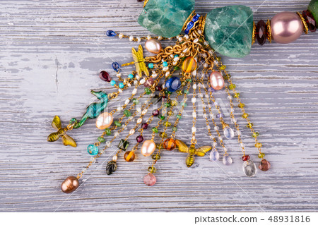 A necklace brush from a scattering of garnets and  48931816