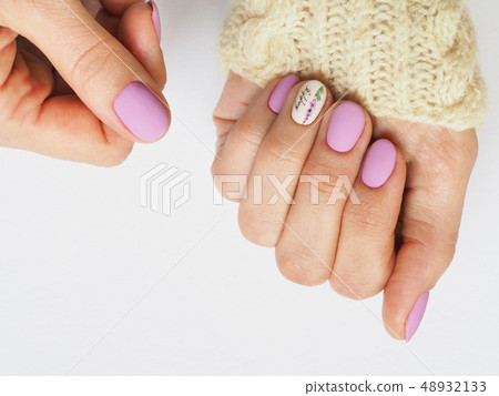 Fashionable lilac manicure design in the hand. 48932133