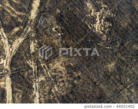 Devastated land, after a fire, top view. Disaster Devastated land, after a fire, top view. Disaster 48932402