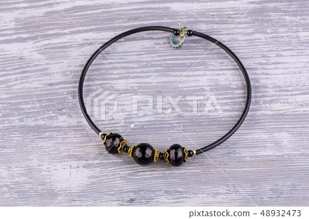 A necklace with beads of black agate with a facet A necklace with beads of black agate with a facet 48932473