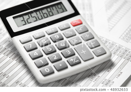Calculator and reports closeup. Office supplies Calculator and reports closeup. Office supplies 48932633