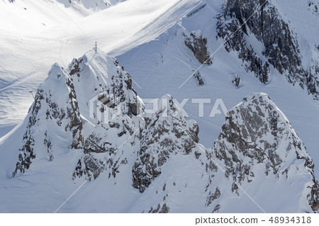 beautiful Alps mountain lanscape rocks under snow 48934318