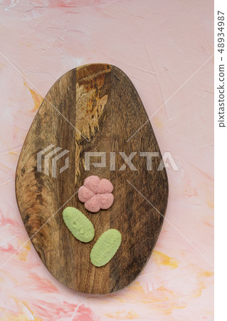SPRING word and flower cookies on a wooden board 48934987