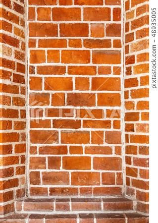 Recess arch frame in old brick wall 48935005