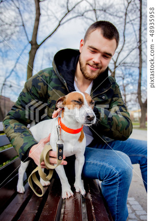 Young man with his dog, Jack Russell Terrier, 48935958