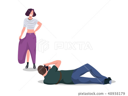 professional man photographer on lying pose shooting beautiful woman model posing modern photo professional man photographer on lying pose shooting beautiful woman model posing modern photo 48938179