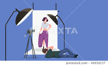 professional man photographer on lying pose shooting beautiful sexy woman model posing modern photo 48938237