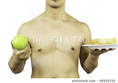 Man holding green apple and slice of bread in clipping path. Man holding green apple and slice of bread in clipping path. 48938330