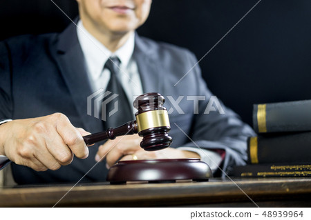 justice and law concept.Male judge in a courtroom justice and law concept.Male judge in a courtroom 48939964