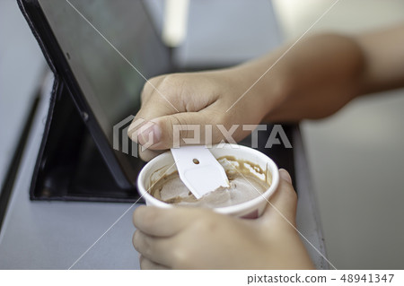 Hand boy holding the spoon Ice cream scoop. Hand boy holding the spoon Ice cream scoop. 48941347