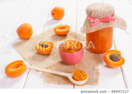 Fresh prepared apricot marmalade and ripe fruits Fresh prepared apricot marmalade and ripe fruits 48941527