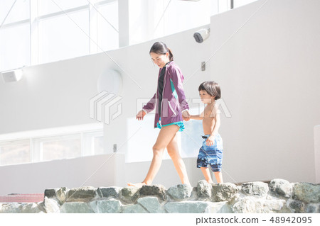 Resort hotel pool parent and child 48942095