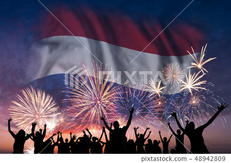 People are looking on fireworks and flag of People are looking on fireworks and flag of 48942809