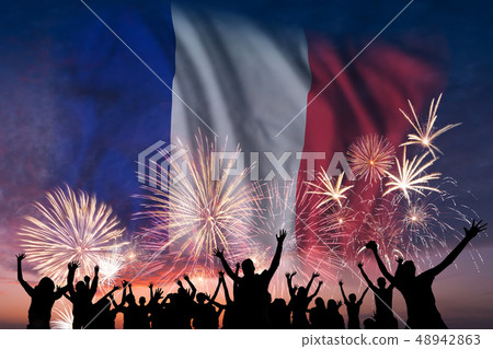People are looking on fireworks and flag of France People are looking on fireworks and flag of France 48942863