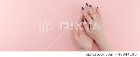 Woman's hands with black manicure 48944190