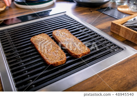 Bread slices are grilled. Master class Bread slices are grilled. Master class 48945540