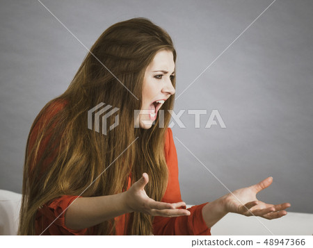 Angry woman complaining Angry woman complaining 48947366