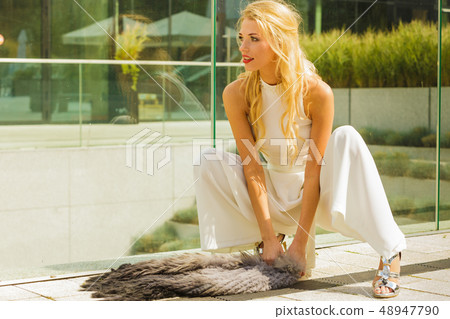 Woman wearing crop top and culottes Woman wearing crop top and culottes 48947790