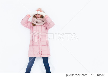Young positive girl on white isolated background Young positive girl on white isolated background 48948588