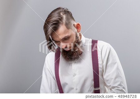 people, fashion and style concept - close-up portrait of young hipster on grey background 48948728