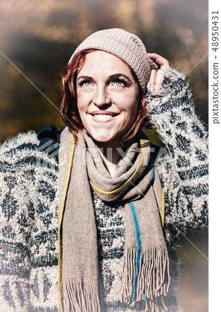 portrait of a smiling woman in snow 48950431