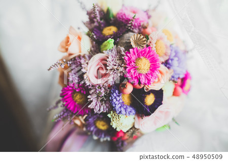 Beautiful wedding bouquet with different flowers, roses Beautiful wedding bouquet with different flowers, roses 48950509