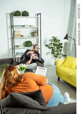 Relaxed red-haired female person listening to her therapist 48950672