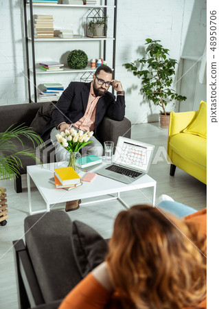 Professional young therapist consulting his overweight client 48950706