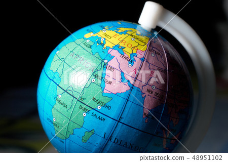 toy globe closeup view on dark background 48951102