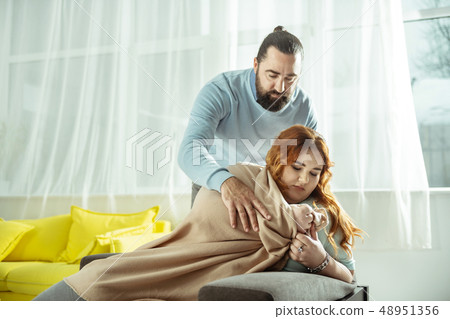 Upset overweight woman being deep in her thoughts Upset overweight woman being deep in her thoughts 48951356