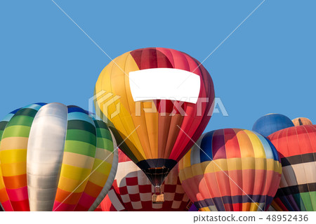 Stacked colorful hot air balloons with blue sky 48952436