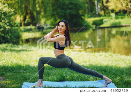 girl practicing yoga 48952719