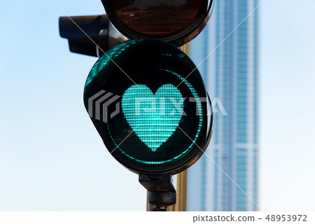 Heart shaped traffic light on the street Heart shaped traffic light on the street 48953972