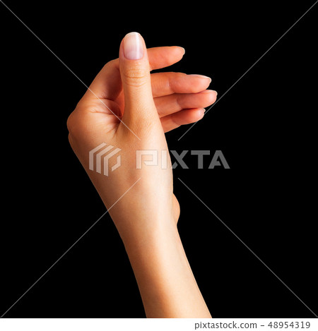Woman hand holding something with two fingers Woman hand holding something with two fingers 48954319