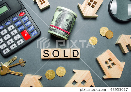 Wooden houses, a calculator, keys, coins Wooden houses, a calculator, keys, coins 48955017
