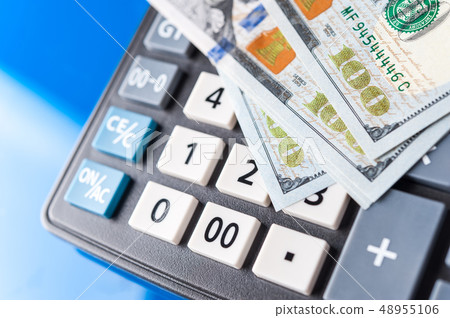 Business and financial background with dollars and calculator. Bookkeeping background. Business and financial background with dollars and calculator. Bookkeeping background. 48955106