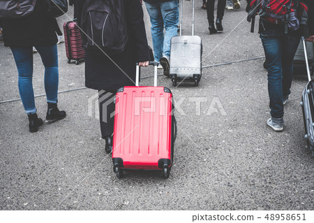group tourists with rolling suitcase / trolley , 48958651