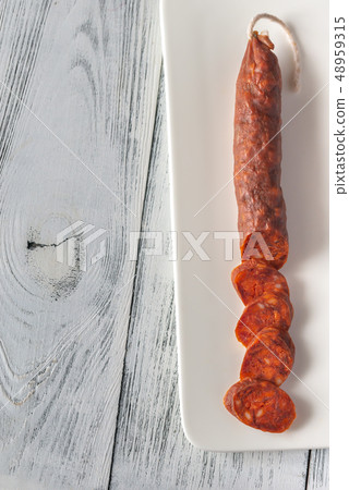Spanish chorizo on the white background Spanish chorizo on the white background 48959315