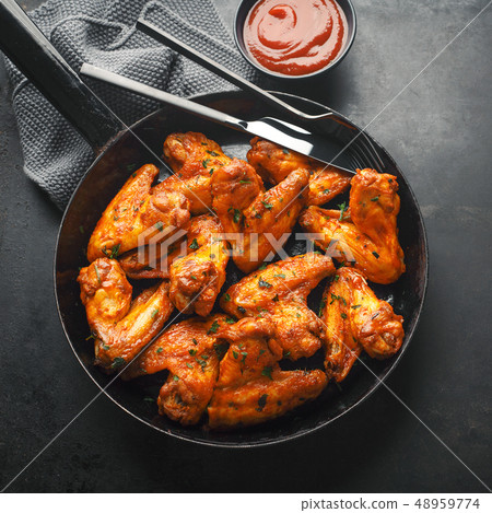 Chicken wings grilled in sauce on pan 48959774