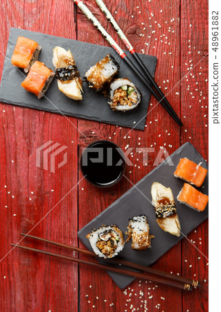 Rolls served at red table Rolls served at red table 48961882