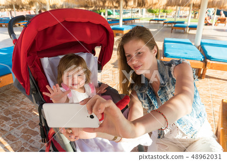 Mother and daughter making selfie on resort 48962031