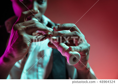 African American jazz musician playing pipe. 48964324