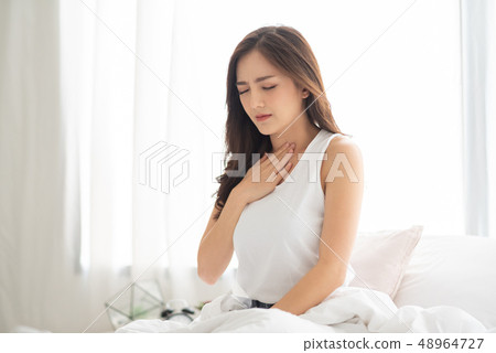 Asian Woman with Acid Reflux. 48964727