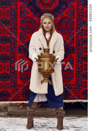 Russian beautiful girl at winter countryside Russian beautiful girl at winter countryside 48965204