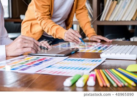 Two colleagues creative graphic designer working 48965890
