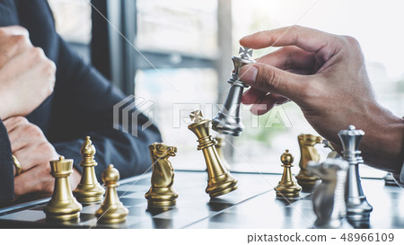 Two businessman playing chess game to plan 48966109