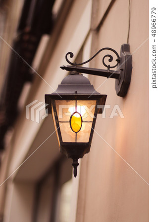 Lamp light on the wall. Vintage street lantern  48966779
